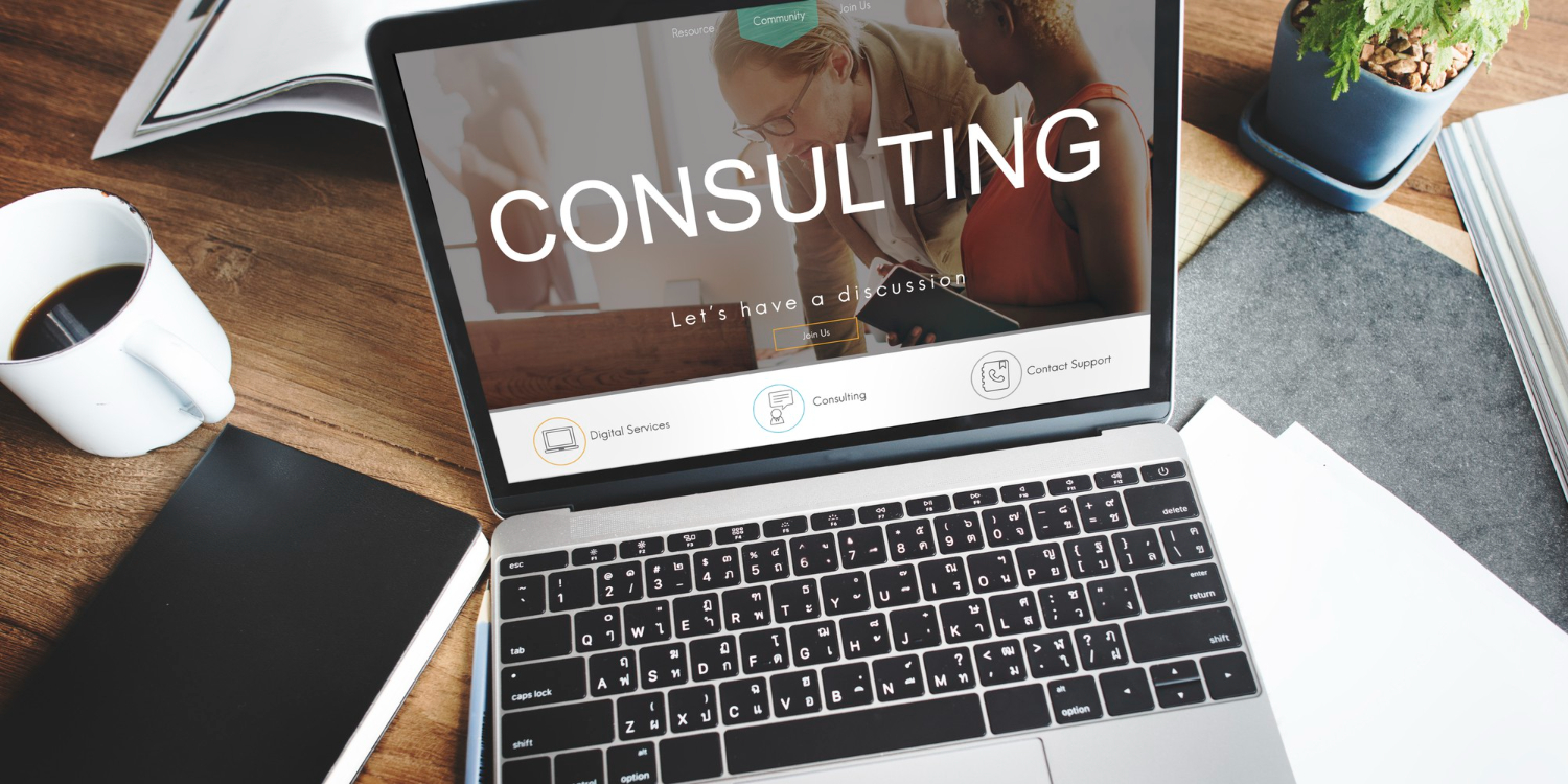 Consulting desk with a laptop prepared for a discussion.